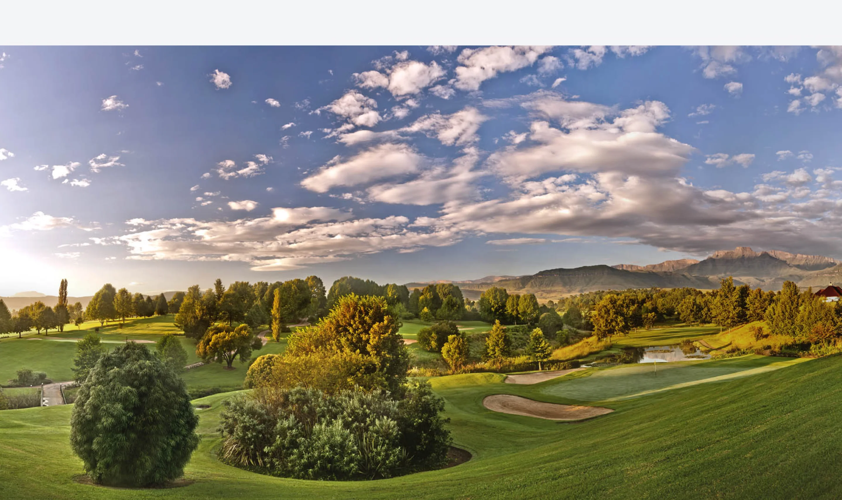 Golf fairway and Drakensberg peaks at Champagne Sports Resort