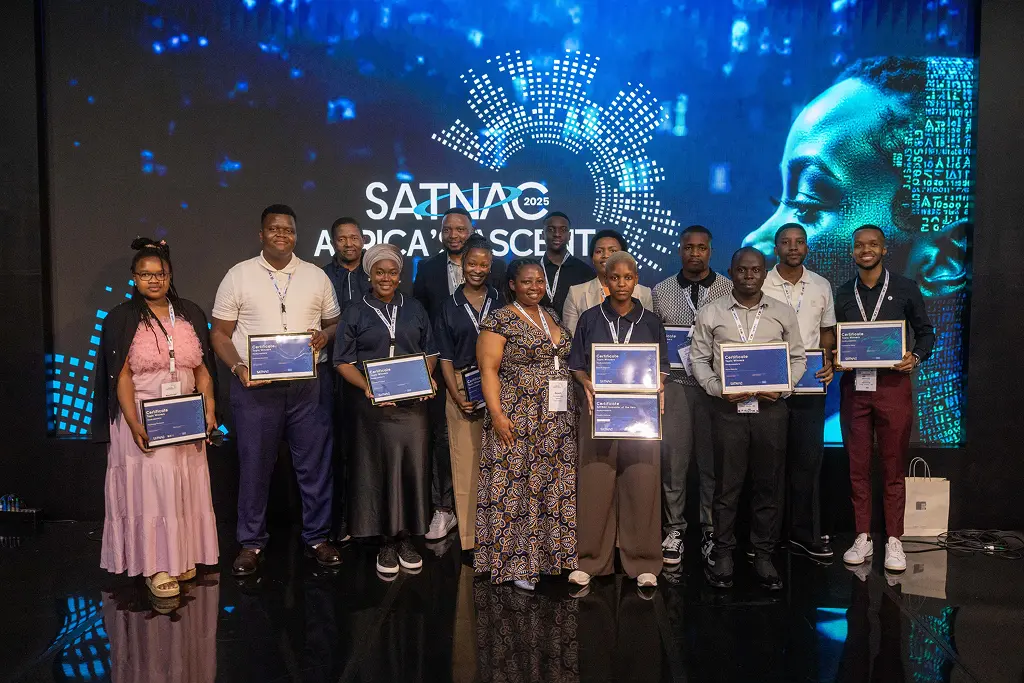 Industry Solutions Challenge topic winners posing on stage with certificates in front of the SATNAC 2025 Africa's Ascent backdrop.