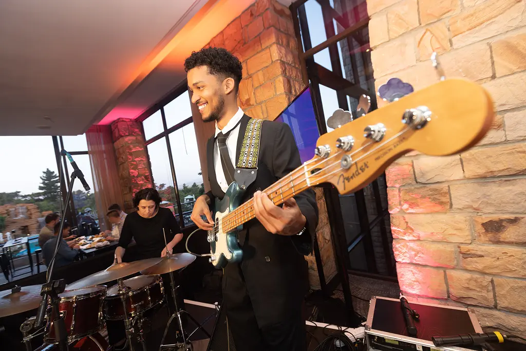 A live band performing during an evening reception at SATNAC 2025.
